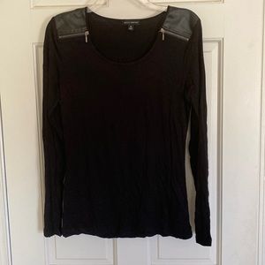 Long sleeved black top.